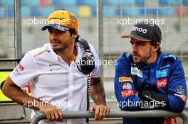 (L to R): Fernando Alonso (ESP) McLaren Test Driver with Carlos Sainz Jr (ESP) McLaren. 02.04.2019. Formula One Testing, Sakhir, Bahrain, Tueday.