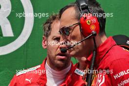 Sebastian Vettel (GER) Ferrari with Riccardo Adami (ITA) Ferrari Race Engineer on the grid. 17.11.2019. Formula 1 World Championship, Rd 20, Brazilian Grand Prix, Sao Paulo, Brazil, Race Day.