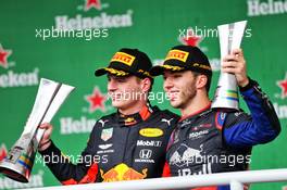 (L to R): Race winner Max Verstappen (NLD) Red Bull Racing with second placed Pierre Gasly (FRA) Scuderia Toro Rosso on the podium. 17.11.2019. Formula 1 World Championship, Rd 20, Brazilian Grand Prix, Sao Paulo, Brazil, Race Day.