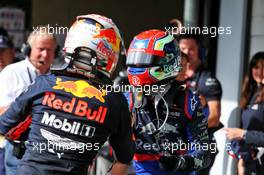 (L to R): Race winner Max Verstappen (NLD) Red Bull Racing celebrates in parc ferme with second placed Pierre Gasly (FRA) Scuderia Toro Rosso STR14. 17.11.2019. Formula 1 World Championship, Rd 20, Brazilian Grand Prix, Sao Paulo, Brazil, Race Day.
