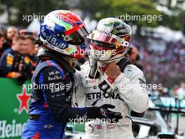 (L to R): Pierre Gasly (FRA) Scuderia Toro Rosso celebrates his second position with Lewis Hamilton (GBR) Mercedes AMG F1 in parc ferme. 17.11.2019. Formula 1 World Championship, Rd 20, Brazilian Grand Prix, Sao Paulo, Brazil, Race Day.