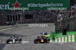 Lewis Hamilton (GBR) Mercedes AMG F1 W10 and Alexander Albon (THA) Red Bull Racing RB15 battle for position. 17.11.2019. Formula 1 World Championship, Rd 20, Brazilian Grand Prix, Sao Paulo, Brazil, Race Day.