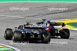 Kevin Magnussen (DEN) Haas VF-19 and Daniil Kvyat (RUS) Scuderia Toro Rosso STR14 battle for position. 17.11.2019. Formula 1 World Championship, Rd 20, Brazilian Grand Prix, Sao Paulo, Brazil, Race Day.