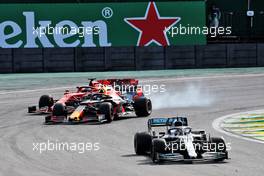 Lewis Hamilton (GBR) Mercedes AMG F1 W10 leads Alexander Albon (THA) Red Bull Racing RB15 and Sebastian Vettel (GER) Ferrari SF90. 17.11.2019. Formula 1 World Championship, Rd 20, Brazilian Grand Prix, Sao Paulo, Brazil, Race Day.