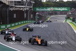 Carlos Sainz Jr (ESP), McLaren F1 Team and Kimi Raikkonen (FIN), Alfa Romeo Racing  17.11.2019. Formula 1 World Championship, Rd 20, Brazilian Grand Prix, Sao Paulo, Brazil, Race Day.