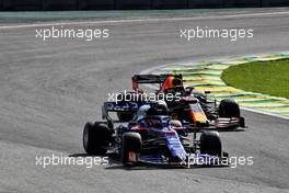 Daniil Kvyat (RUS) Scuderia Toro Rosso STR14 and Alexander Albon (THA) Red Bull Racing RB15. 17.11.2019. Formula 1 World Championship, Rd 20, Brazilian Grand Prix, Sao Paulo, Brazil, Race Day.
