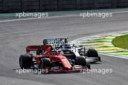 Charles Leclerc (MON) Ferrari SF90 anmd Valtteri Bottas (FIN) Mercedes AMG F1 W10 battle for position. 17.11.2019. Formula 1 World Championship, Rd 20, Brazilian Grand Prix, Sao Paulo, Brazil, Race Day.