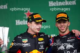 (L to R): Race winner Max Verstappen (NLD) Red Bull Racing celebrates on the podium with second placed Pierre Gasly (FRA) Scuderia Toro Rosso. 17.11.2019. Formula 1 World Championship, Rd 20, Brazilian Grand Prix, Sao Paulo, Brazil, Race Day.