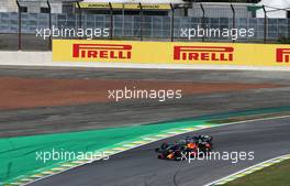Max Verstappen (NLD) Red Bull Racing RB15 and Lewis Hamilton (GBR) Mercedes AMG F1 W10 battle for the lead of the race. 17.11.2019. Formula 1 World Championship, Rd 20, Brazilian Grand Prix, Sao Paulo, Brazil, Race Day.
