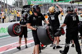 Haas F1 Team mechanics in the pits.