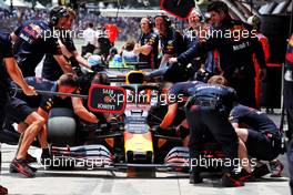 Max Verstappen (NLD) Red Bull Racing RB15 in the pits.