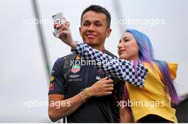 Alexander Albon (THA) Red Bull Racing with a fan. 14.11.2019. Formula 1 World Championship, Rd 20, Brazilian Grand Prix, Sao Paulo, Brazil, Preparation Day.