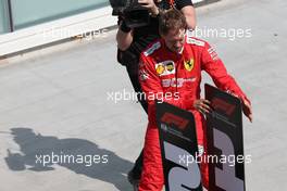 Sebastian Vettel (GER) Ferrari SF90 moves the 1st and 2nd place boards. 09.06.2019. Formula 1 World Championship, Rd 7, Canadian Grand Prix, Montreal, Canada, Race Day.