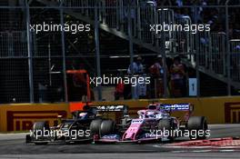 Romain Grosjean (FRA) Haas F1 Team VF-19 and Sergio Perez (MEX) Racing Point F1 Team RP19 battle for position. 09.06.2019. Formula 1 World Championship, Rd 7, Canadian Grand Prix, Montreal, Canada, Race Day.