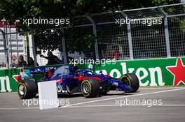 Alexander Albon (THA) Scuderia Toro Rosso STR14 in the pits with a damaged front wing. 09.06.2019. Formula 1 World Championship, Rd 7, Canadian Grand Prix, Montreal, Canada, Race Day.