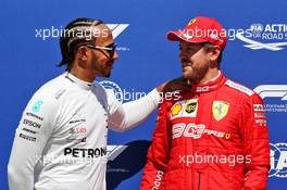 (L to R): Lewis Hamilton (GBR) Mercedes AMG F1 with pole sitter Sebastian Vettel (GER) Ferrari in qualifying parc ferme. 08.06.2019. Formula 1 World Championship, Rd 7, Canadian Grand Prix, Montreal, Canada, Qualifying Day.
