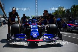 The Scuderia Toro Rosso STR14 of Alexander Albon (THA) is pushed down the pit lane by mechanics. 06.06.2019. Formula 1 World Championship, Rd 7, Canadian Grand Prix, Montreal, Canada, Preparation Day.