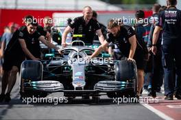 The Mercedes AMG F1 W10 of Valtteri Bottas (FIN) is pushed down the pit lane by mechanics. 06.06.2019. Formula 1 World Championship, Rd 7, Canadian Grand Prix, Montreal, Canada, Preparation Day.