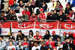 Charles Leclerc (MON) Ferrari fans in the grandstand. 12.04.2019. Formula 1 World Championship, Rd 3, Chinese Grand Prix, Shanghai, China, Practice Day.