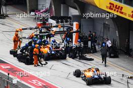 Carlos Sainz Jr (ESP) McLaren MCL34 and team mate Lando Norris (GBR) McLaren MCL34 pit on the opening lap of the race. 14.04.2019. Formula 1 World Championship, Rd 3, Chinese Grand Prix, Shanghai, China, Race Day.