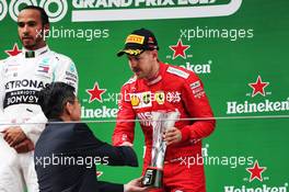 Sebastian Vettel (GER) Ferrari celebrates his third position on the podium. 14.04.2019. Formula 1 World Championship, Rd 3, Chinese Grand Prix, Shanghai, China, Race Day.