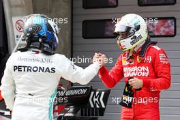 (L to R): Valtteri Bottas (FIN) Mercedes AMG F1 celebrates his second position with third placed Sebastian Vettel (GER) Ferrari in parc ferme. 14.04.2019. Formula 1 World Championship, Rd 3, Chinese Grand Prix, Shanghai, China, Race Day.