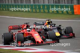 Sebastian Vettel (GER) Ferrari SF90 and Max Verstappen (NLD) Red Bull Racing RB15. 14.04.2019. Formula 1 World Championship, Rd 3, Chinese Grand Prix, Shanghai, China, Race Day.