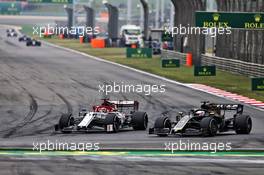 Kimi Raikkonen (FIN) Alfa Romeo Racing C38 and Romain Grosjean (FRA) Haas F1 Team VF-19 battle for position. 14.04.2019. Formula 1 World Championship, Rd 3, Chinese Grand Prix, Shanghai, China, Race Day.