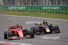 Sebastian Vettel (GER) Ferrari SF90 and Max Verstappen (NLD) Red Bull Racing RB15. 14.04.2019. Formula 1 World Championship, Rd 3, Chinese Grand Prix, Shanghai, China, Race Day.