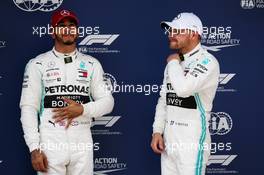 (L to R): Lewis Hamilton (GBR) Mercedes AMG F1 with pole sitter and team mate Valtteri Bottas (FIN) Mercedes AMG F1 in qualifying parc ferme. 13.04.2019. Formula 1 World Championship, Rd 3, Chinese Grand Prix, Shanghai, China, Qualifying Day.