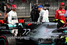 (L to R): Lewis Hamilton (GBR) Mercedes AMG F1 with team mate Valtteri Bottas (FIN) Mercedes AMG F1 in qualifying parc ferme. 13.04.2019. Formula 1 World Championship, Rd 3, Chinese Grand Prix, Shanghai, China, Qualifying Day.