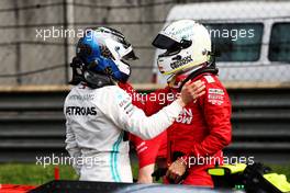 (L to R): Valtteri Bottas (FIN) Mercedes AMG F1 celebrates his pole position with third placed Sebastian Vettel (GER) Ferrari in qualifying parc ferme. 13.04.2019. Formula 1 World Championship, Rd 3, Chinese Grand Prix, Shanghai, China, Qualifying Day.