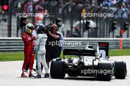 Valtteri Bottas (FIN) Mercedes AMG F1 celebrates his pole position in qualifying parc ferme with Sebastian Vettel (GER) Ferrari. 13.04.2019. Formula 1 World Championship, Rd 3, Chinese Grand Prix, Shanghai, China, Qualifying Day.