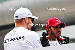 (L to R): Valtteri Bottas (FIN) Mercedes AMG F1 and Lewis Hamilton (GBR) Mercedes AMG F1 on the drivers parade. 14.04.2019. Formula 1 World Championship, Rd 3, Chinese Grand Prix, Shanghai, China, Race Day.