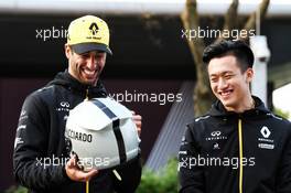 Retro helmet design for Daniel Ricciardo (AUS) Renault F1 Team, with Guanyu Zhou (CHN) Renault F1 Team Test and Development Driver (Right), to celebrate the 1000th F1 GP. 11.04.2019. Formula 1 World Championship, Rd 3, Chinese Grand Prix, Shanghai, China, Preparation Day.