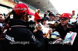 Lewis Hamilton (GBR) Mercedes AMG F1 signs autographs for the fans. 11.04.2019. Formula 1 World Championship, Rd 3, Chinese Grand Prix, Shanghai, China, Preparation Day.