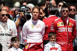 (L to R): Valtteri Bottas (FIN) Mercedes AMG F1; Sebastian Vettel (GER) Ferrari; and Charles Leclerc (MON) Ferrari, as the grid observes the national anthem. 12.05.2019. Formula 1 World Championship, Rd 5, Spanish Grand Prix, Barcelona, Spain, Race Day.