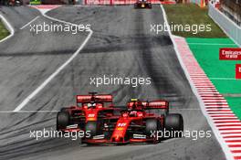 Charles Leclerc (MON) Ferrari SF90 passes team mate Sebastian Vettel (GER) Ferrari SF90. 12.05.2019. Formula 1 World Championship, Rd 5, Spanish Grand Prix, Barcelona, Spain, Race Day.