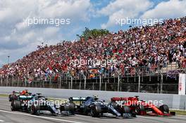 (L to R): Lewis Hamilton (GBR) Mercedes AMG F1 W10, Valtteri Bottas (FIN) Mercedes AMG F1 W10, and Sebastian Vettel (GER) Ferrari SF90 at the start of the race. 12.05.2019. Formula 1 World Championship, Rd 5, Spanish Grand Prix, Barcelona, Spain, Race Day.