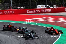 Lewis Hamilton (GBR) Mercedes AMG F1 W10 leads Sebastian Vettel (GER) Ferrari SF90 and Valtteri Bottas (FIN) Mercedes AMG F1 W10 at the start of the race. 12.05.2019. Formula 1 World Championship, Rd 5, Spanish Grand Prix, Barcelona, Spain, Race Day.