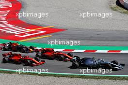 Valtteri Bottas (FIN) Mercedes AMG F1 W10 leads Sebastian Vettel (GER) Ferrari SF90 and Charles Leclerc (MON) Ferrari SF90 at the start of the race. 12.05.2019. Formula 1 World Championship, Rd 5, Spanish Grand Prix, Barcelona, Spain, Race Day.