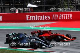 Lewis Hamilton (GBR) Mercedes AMG F1 W10, Valtteri Bottas (FIN) Mercedes AMG F1 W10, and Sebastian Vettel (GER) Ferrari SF90 at the start of the race. 12.05.2019. Formula 1 World Championship, Rd 5, Spanish Grand Prix, Barcelona, Spain, Race Day.