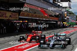 Lewis Hamilton (GBR) Mercedes AMG F1 W10 and Charles Leclerc (MON) Ferrari SF90 leave the pits. 11.05.2019. Formula 1 World Championship, Rd 5, Spanish Grand Prix, Barcelona, Spain, Qualifying Day.