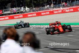 Sebastian Vettel (GER) Ferrari SF90 leads Lewis Hamilton (GBR) Mercedes AMG F1 W10 to parc ferme. 11.05.2019. Formula 1 World Championship, Rd 5, Spanish Grand Prix, Barcelona, Spain, Qualifying Day.