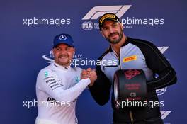 Valtteri Bottas (FIN) Mercedes AMG F1 celebrates the Pirelli Pole Position award with Claudio Castagnoli 'Cesaro' (SUI) WWE Wrestler. 11.05.2019. Formula 1 World Championship, Rd 5, Spanish Grand Prix, Barcelona, Spain, Qualifying Day.