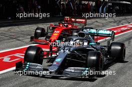 Lewis Hamilton (GBR) Mercedes AMG F1 W10 and Charles Leclerc (MON) Ferrari SF90 leave the pits. 11.05.2019. Formula 1 World Championship, Rd 5, Spanish Grand Prix, Barcelona, Spain, Qualifying Day.