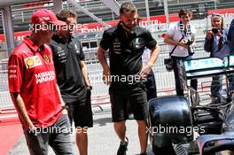 Sebastian Vettel (GER) Ferrari with members of the Mercedes AMG F1 team. 09.05.2019. Formula 1 World Championship, Rd 5, Spanish Grand Prix, Barcelona, Spain, Preparation Day.