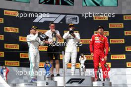 The podium (L to R): Valtteri Bottas (FIN) Mercedes AMG F1, second; Nathan Divey (GBR) Mercedes AMG F1 No1 Mechanic; Lewis Hamilton (GBR) Mercedes AMG F1, race winner; Charles Leclerc (MON) Ferrari, third. 23.06.2019. Formula 1 World Championship, Rd 8, French Grand Prix, Paul Ricard, France, Race Day.