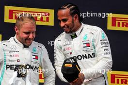 (L to R): Second placed Valtteri Bottas (FIN) Mercedes AMG F1 on the podium with race winner Lewis Hamilton (GBR) Mercedes AMG F1. 23.06.2019. Formula 1 World Championship, Rd 8, French Grand Prix, Paul Ricard, France, Race Day.