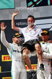 The podium (L to R): second placed Valtteri Bottas (FIN) Mercedes AMG F1 celebrates with Nathan Divey (GBR) Mercedes AMG F1 No1 Mechanic and race winner Lewis Hamilton (GBR) Mercedes AMG F1. 23.06.2019. Formula 1 World Championship, Rd 8, French Grand Prix, Paul Ricard, France, Race Day.